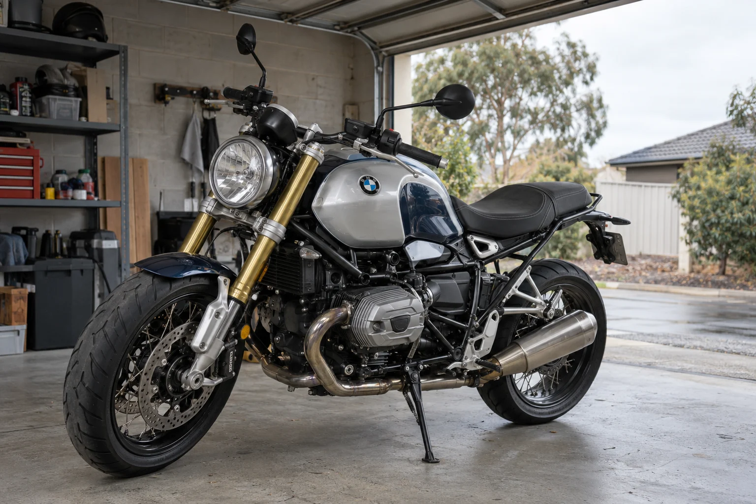 Silver BMW roadster parked in a garage with natural daylight